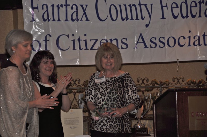 Mason District Council Vice Chair Loretta Principe and 2010 Citizen of the Year Mollie Loeffler Applaud as Ellie Ashford Receives a Citation of Merit