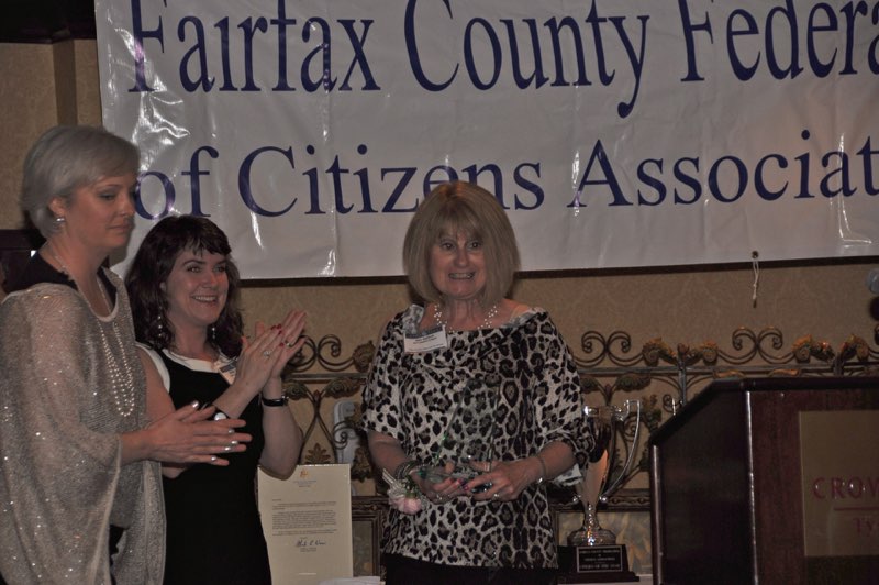 Mason District Council Vice Chair Loretta Principe and 2010 Citizen of the Year Mollie Loeffler Applaud as Ellie Ashford Receives a Citation of Merit