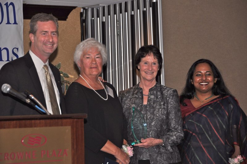 Delegate David Bulova as Suzanne Harsel receives the Special Gratitude Award from County Chair Sharon Bulova with Federation President Tania Hossain