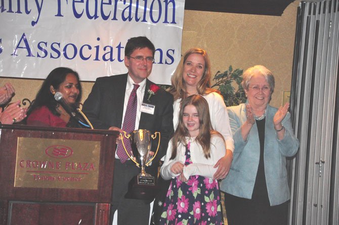 From left, Fairfax County Federation of Citizens Associations President Tania Hossain, Walter Alcorn of the Fairfax County Planning Commission, his wife Kristina, daughter Delia and former Board of Supervisors Chair Katherine Hanley. Alcorn was awarded the federation’s Citizen of the Year award Sunday, March 25. 