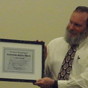 C. Flint Webb accepts the Community Service Award from the Providence District Council on Dec. 7.